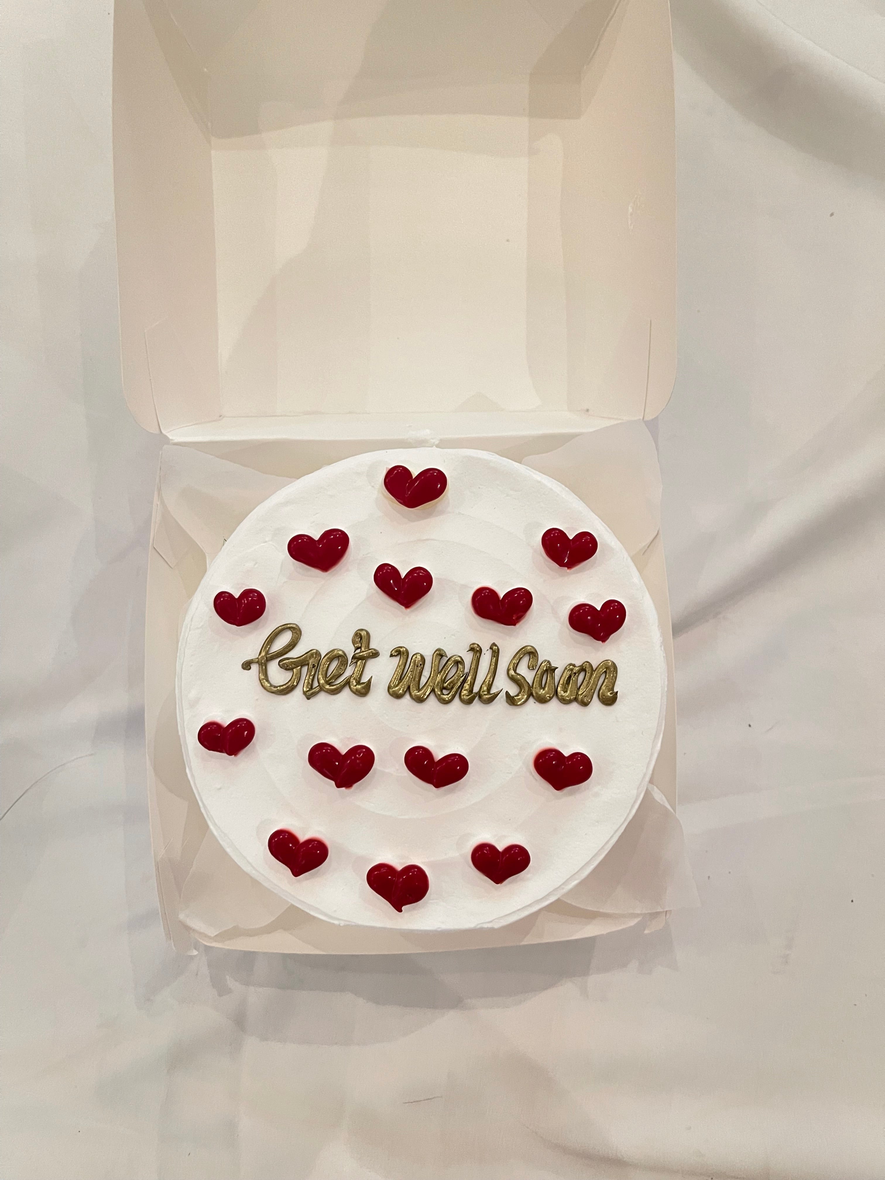 White cake with red hearts